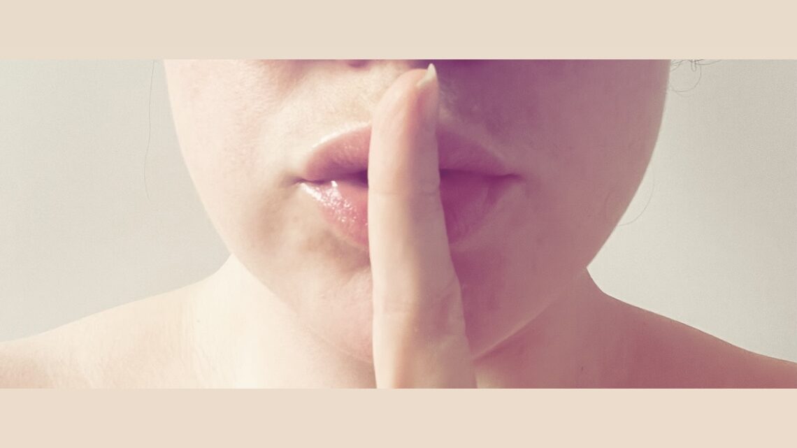 Women quiet covering lips